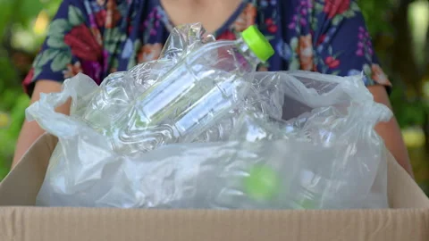 Plastic waste in a cardboard box, used plastic bottles waste in plastic bag Stock Footage 328248475