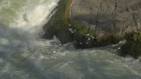 Plastic waste caught in rapids at Li Phi Falls Vídeos de archivo 334997972