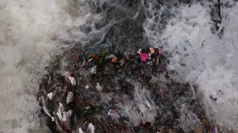 Plastic waste clogs waterways. Plastic waste in the gutter. Video stock 273047249