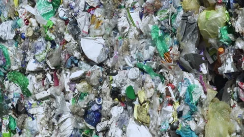 PLASTIC WASTE compacted in a bale lying in the sun Stock Footage 263611862