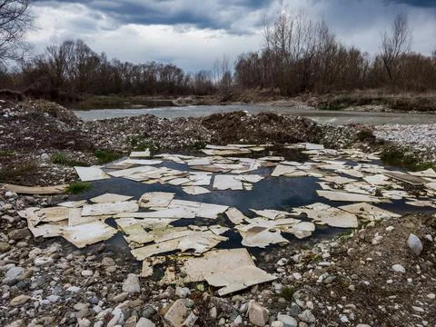 Plastic waste floating in the river Stock Photos