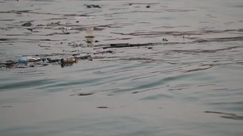 Plastic waste floats on water in Samut Prakan Video stock 339871975