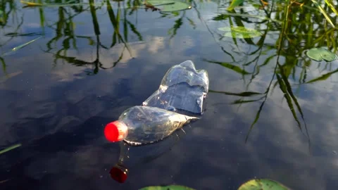 Plastic waste in lake. Ocean pollution, marine debris. Stock Footage 282107656