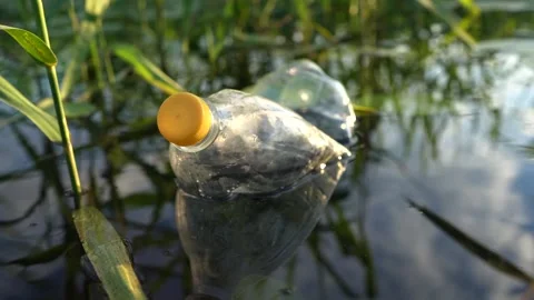 Plastic waste in lake. Ocean pollution, marine debris. Marine litter Stock Footage 282307103
