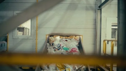 Plastic Waste Moving Along a Conveyor Belt at a Recycling Facility Plant 库存影片 331166536