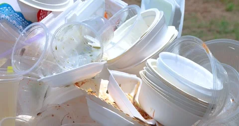 Plastic waste pile including cups and foam containers, Garbage pile, Plastic Stock Footage 333925859