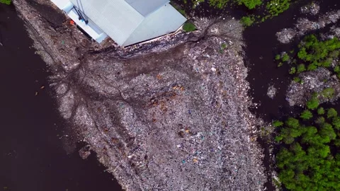 Plastic waste polluting environment dump with cows. Lovely aerial view drone 스톡 동영상 332617027