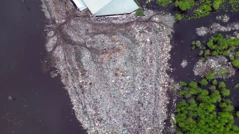 Plastic waste polluting environment dump with cows. Gorgeous aerial view drone 스톡 동영상 332617216