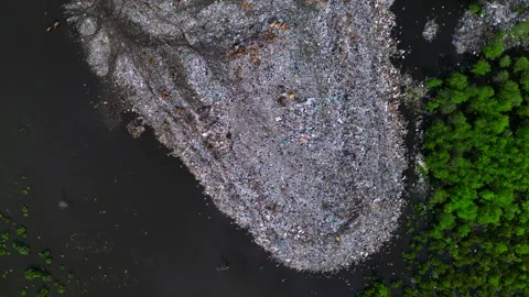 Plastic waste polluting environment dump with cows. Perfect aerial view drone 스톡 동영상 332617218