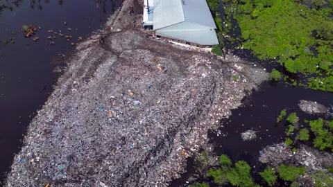 Plastic waste polluting environment dump with cows. Nice aerial view drone Stock-Footage 344608148
