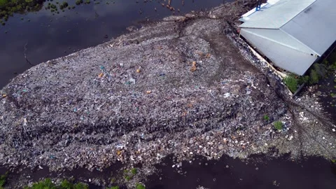 Plastic waste polluting environment dump with cows. Great aerial view drone Stock-Footage 344615608