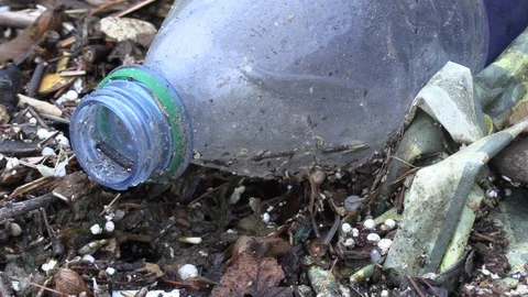 Plastic waste pollution floating in water Stock Footage 114436455