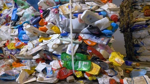 Plastic waste pressed and tied up compactly. Video stock 76354941