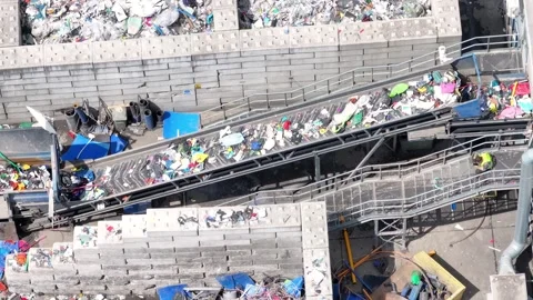 Plastic waste processing operation at recycling facility in action Stock Footage 337910363