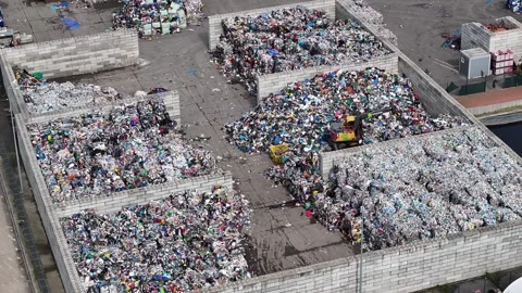 Plastic waste processing at recycling facility in industrial area Stock Footage 337983556