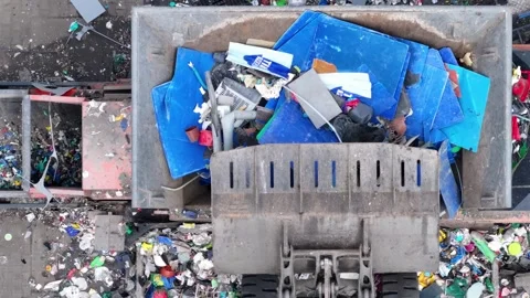 Plastic waste processing at a recycling facility for sustainable management Stock Footage 337983979