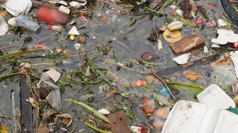 Plastic Waste Rubbish Floating in Lake W... | Stock Video | Pond5