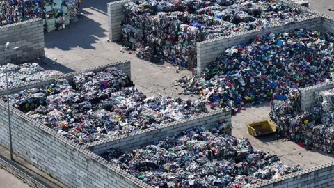 Plastic waste is sorted and processed at a recycling facility Video stock 339029515