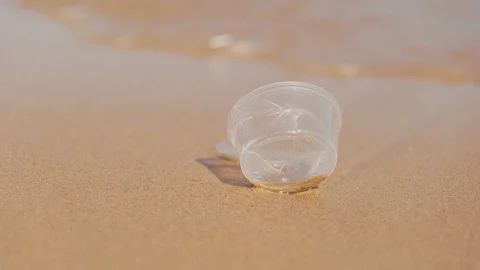 Plastic waste washed ashore on beach. Environmental trash, Garbage. Stock Footage 129872133