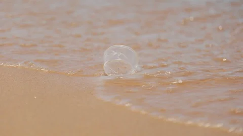 Plastic waste washed ashore on beach. Environmental trash, Garbage. Stock Footage 129872134