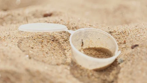 Plastic waste washed ashore on beach. Environmental trash, Garbage. Stock Footage 129872754