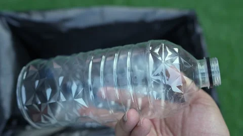 Plastic water bottle drop into a bin for recycle waste. Stock Footage 230222823