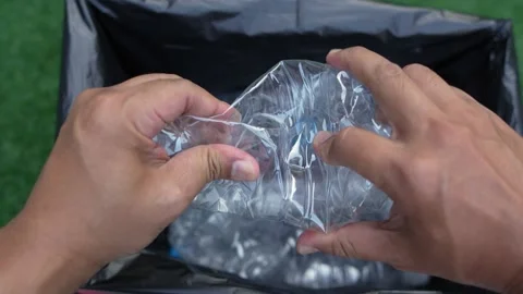 Plastic water bottle drop into a bin for... | Stock Video | Pond5