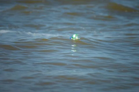 Plastic water bottle floating on the ocean Stock Photos