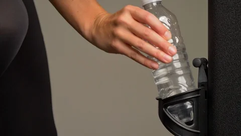 Plastic water bottle on holder Stock Footage 105128101