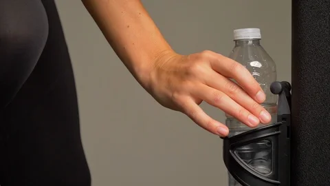 Plastic water bottle returned in holder Video stock 105128257