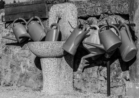 Plastic water cans Stock Photos