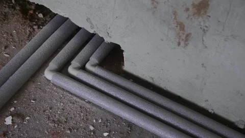 Plastic water supply pipe on the floor. Indoor renovation work Stock Footage 279230778