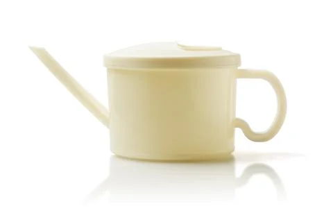 Plastic watering can Stock Photos