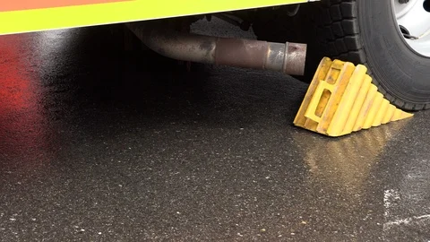 Plastic wheel chock under the wheel Video stock 108338095