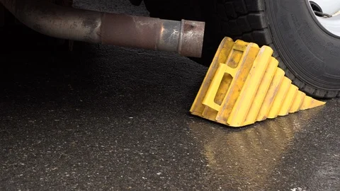 Plastic wheel chock under the wheel Vídeos de archivo 108338804