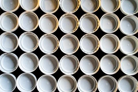 Plastic white trash caps Stock Photos