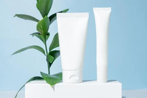 Plastic white tubes for face and eye cream or lotion. Skin care or sunscree.. Stock Photos