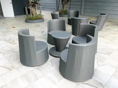 Plastic wicker chairs and table Stock Photos