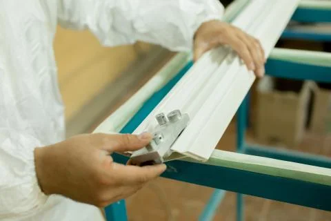 Plastic window assembly. Manufacture of plastic windows. Stock Photos