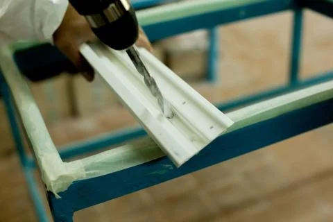 Plastic window assembly. Manufacture of plastic windows. Stock Photos