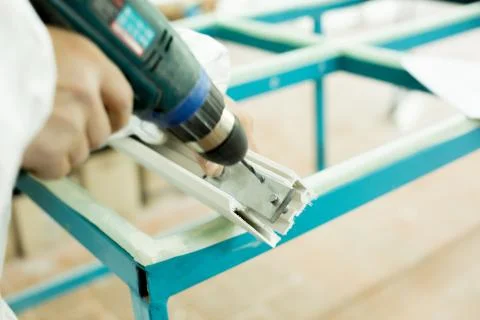 Plastic window assembly. Manufacture of plastic windows. Stock Photos