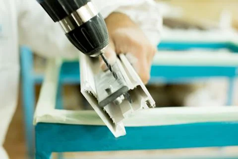 Plastic window assembly. Manufacture of plastic windows. Stock Photos