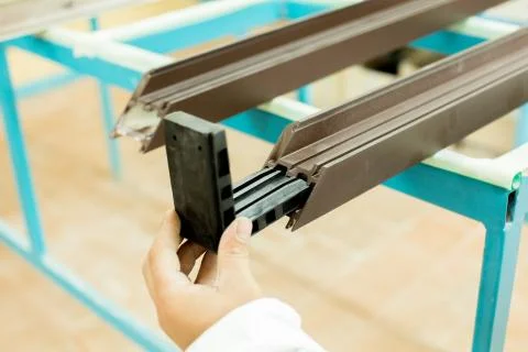 Plastic window assembly. Manufacture of plastic windows. Stock Photos