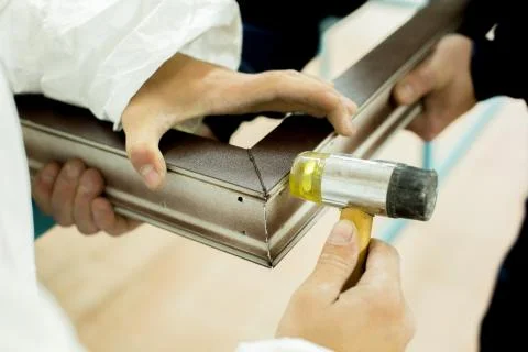 Plastic window assembly. Manufacture of plastic windows. Stock Photos