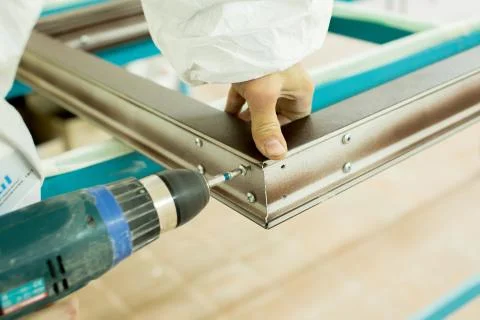 Plastic window assembly. Manufacture of plastic windows. Stock Photos