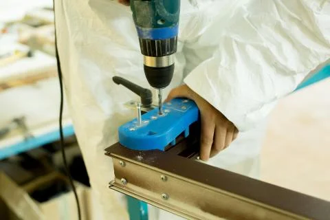 Plastic window assembly. Manufacture of plastic windows. Stock Photos