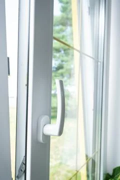 Plastic window handle, window closed, modern PVC profile, proper hardware, .. Stock Photos