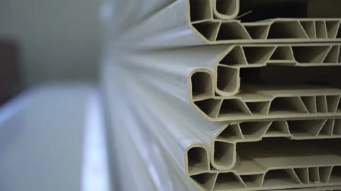 Plastic window sills heap with patterned texture at plant Stock Footage 304394079