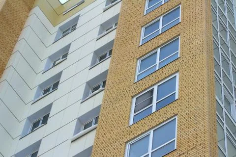 Plastic windows in a modern tiled brick high-rise house. Foto stock