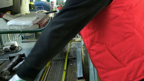 Plastic windows. Worker Cutting PVC Profile with Circular Saw.PVC windows and Stock Footage 83308101